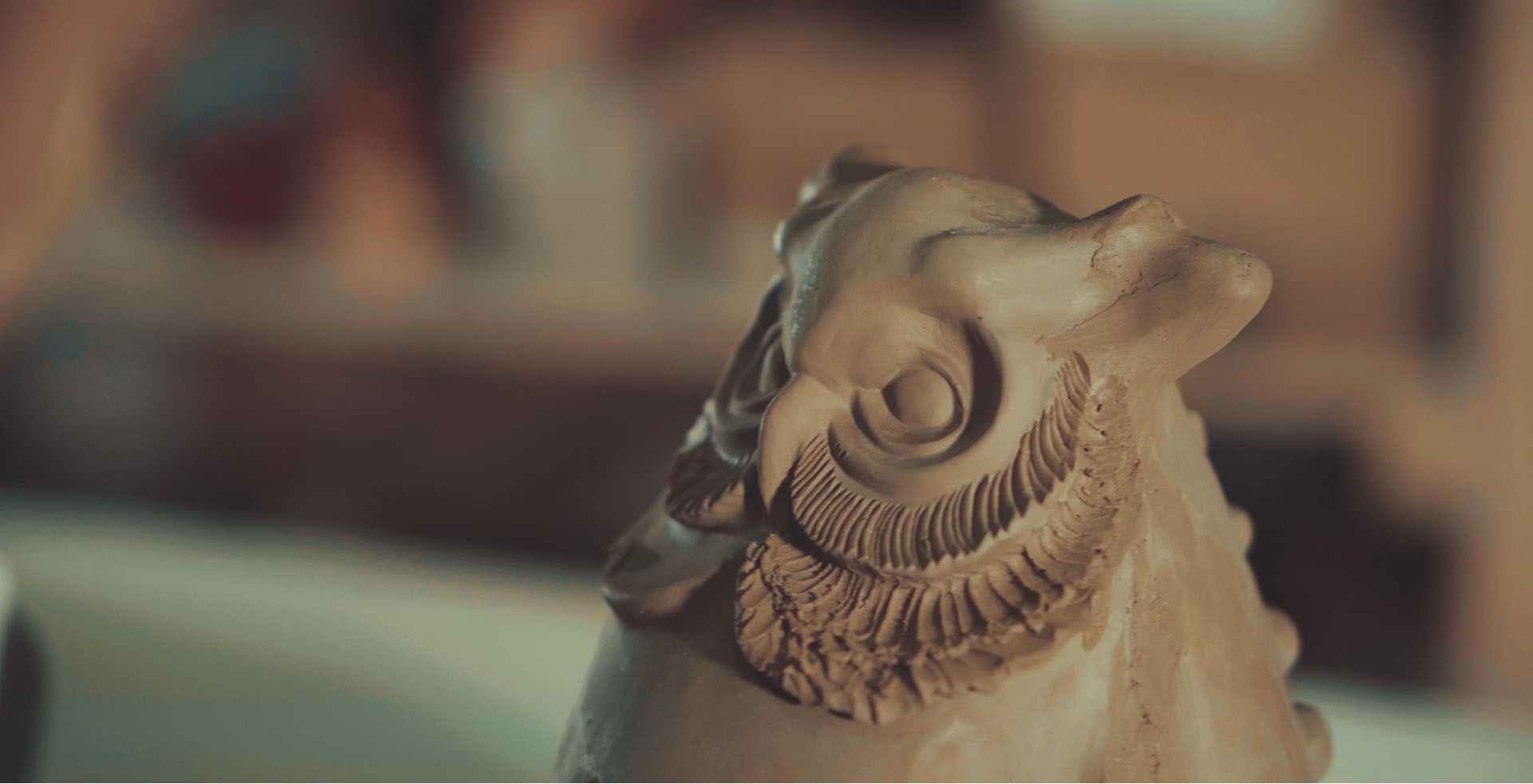Handmade owl pottery in studio